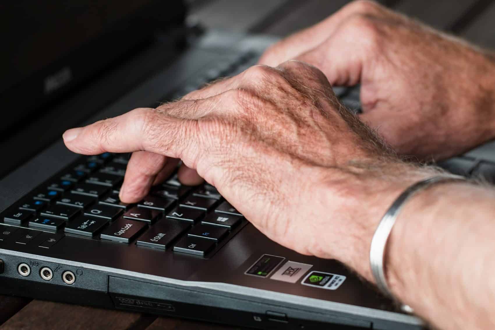 Fingers typing on a computer keyboard
